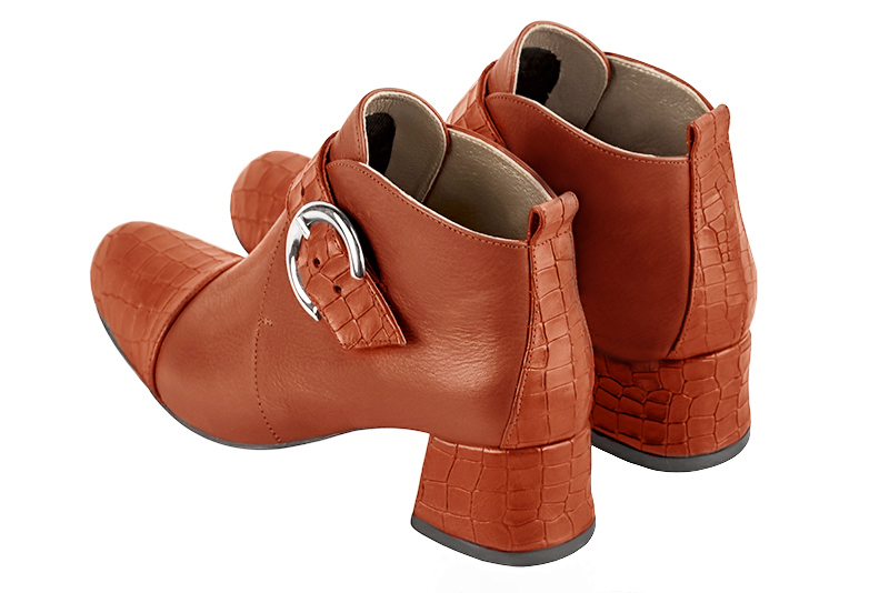 Terracotta orange women's ankle boots with buckles at the front. Round toe. Low flare heels. Rear view - Florence KOOIJMAN